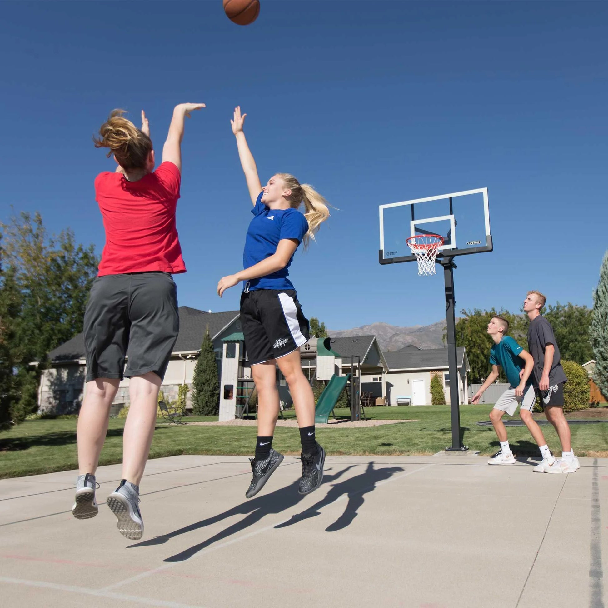 Lifetime 7.5ft. - 10ft. Adjustable Height 60° Tempered Glass Bolt-Down Basketball System (90569)