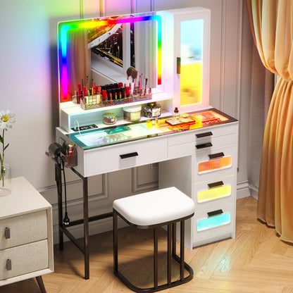 HNEBC Vanity Desk with Mirror and RGB Lights, Glass Top Makeup Vanity with Auto Sensor Lights and Wireless Charging, Vanity Table Set with Cushion Stool, Dressing Table with 6 Drawers (White)